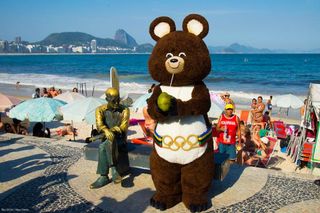 Rio 2016 mascot Misha visits Copacabana beach, which will provide the backdrop for the road race.