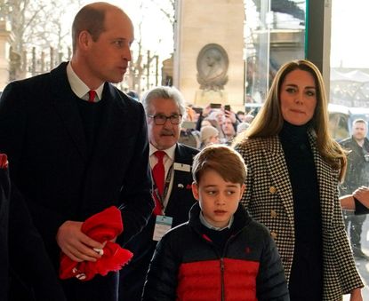 Prince William, Duke of Cambridge, Prince George of Cambridge and Catherine, Duchess of Cambridge, arrive to watch the Six Nations international rugby union match