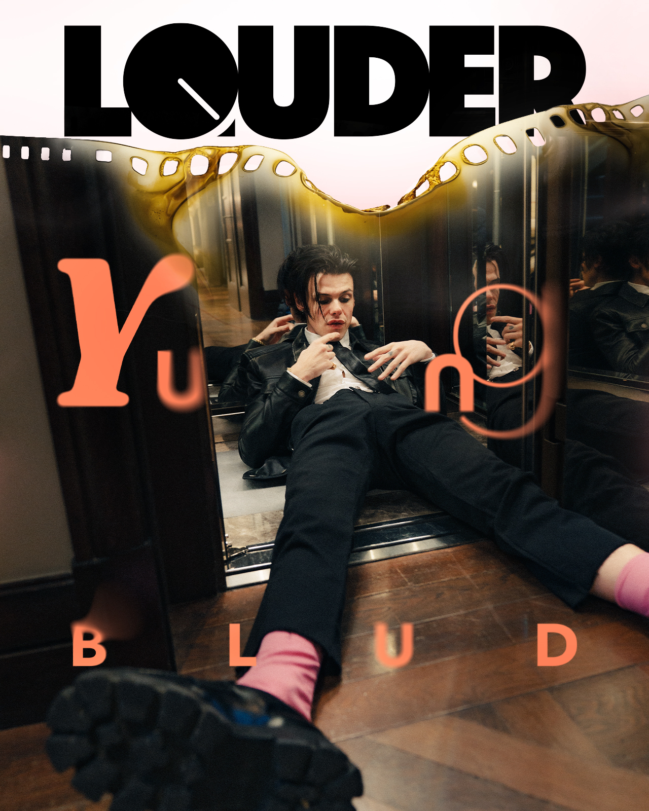 The Louder cover featuring Yungblud sat in a lift in a suit and tie