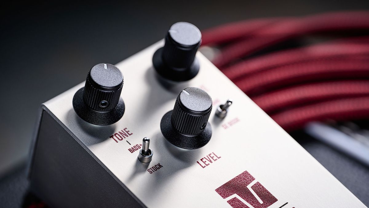 Keeley Electronics Manis: this ingenuous twist ont he K-style overdrive has three-knobs, a couple of mode switches, a tidy white finish and is photographed here against an amp with a red guitar cable.