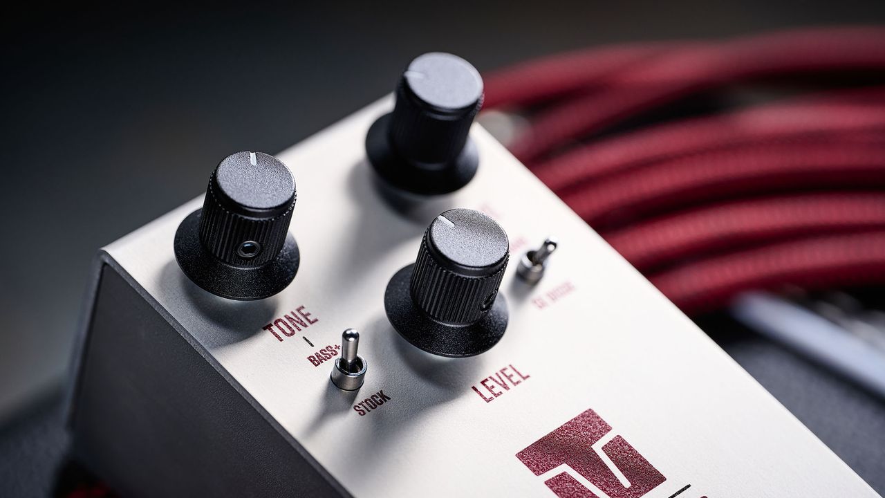 Keeley Electronics Manis: this ingenuous twist ont he K-style overdrive has three-knobs, a couple of mode switches, a tidy white finish and is photographed here against an amp with a red guitar cable.