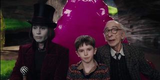 Johnny Depp as Willy Wonka, with Freddie Highmore and David Kelly in Charlie and the Chocolate Facto