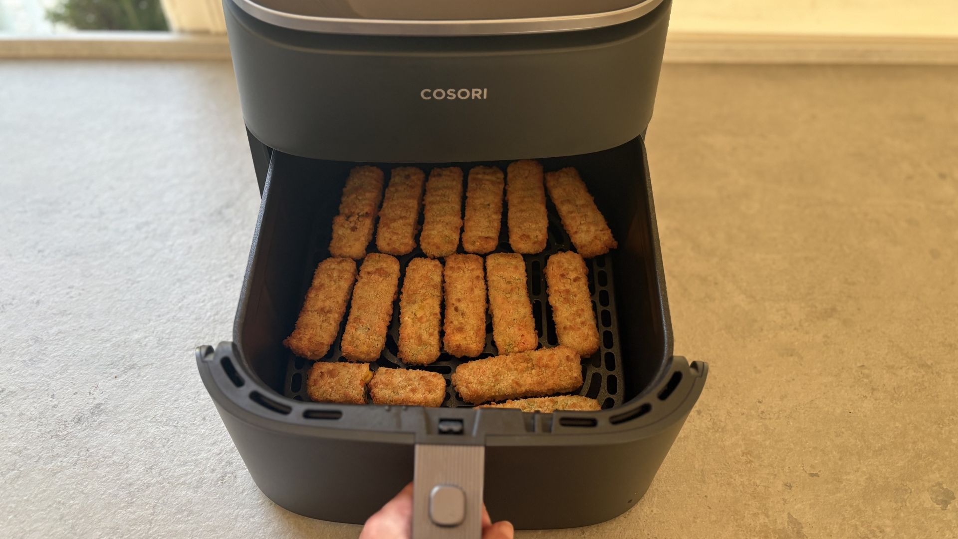 Testing the Cosori TurboBlaze 6L Air Fryer showing the fish fingers