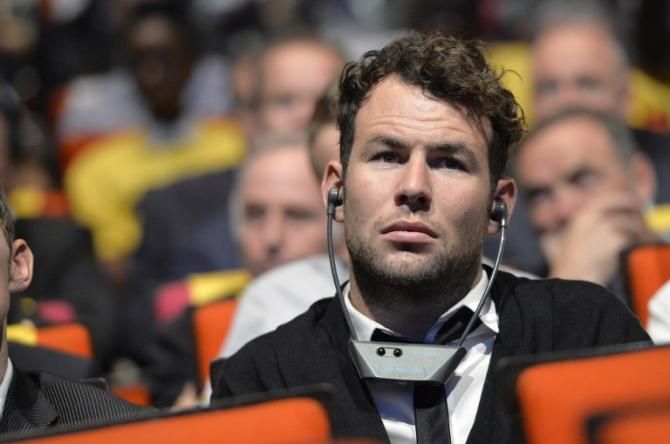 Mark Cavendish listens to the announcement of the 2014 Tour de France route