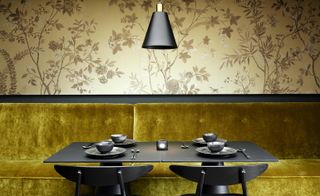Black wood panelling, sculptural tables and chairs.