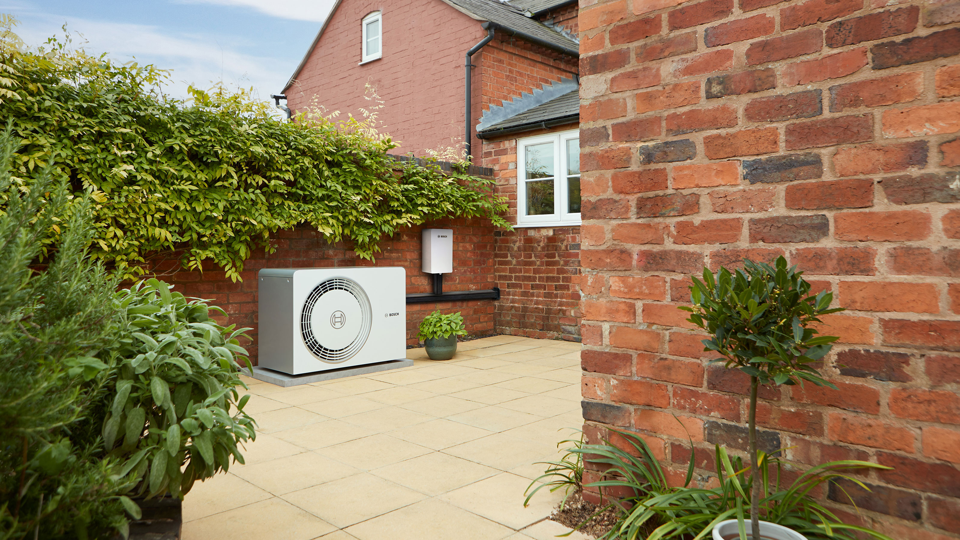 Worcester Bosch heat pump on terrace outside house