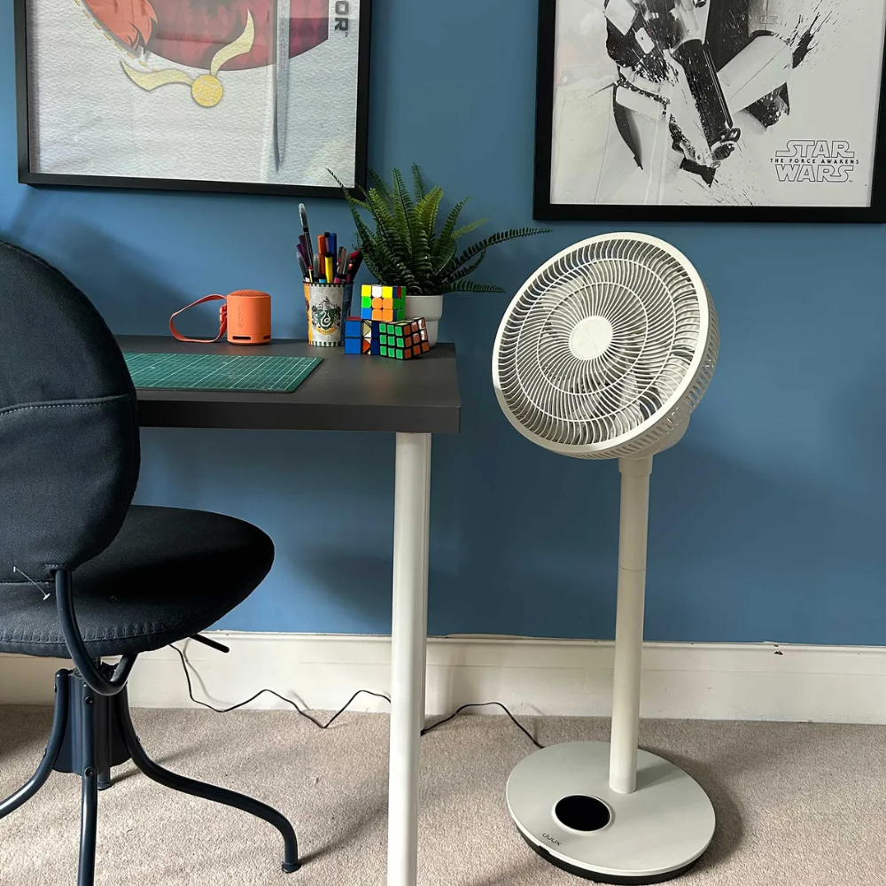 Duux Whisper Flex 2 Smart Fan next to a desk