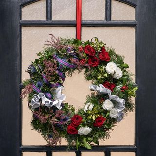 mary queen of scotts wreath with red and white roses thistles heather and tartan ribbon