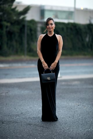 woman wearing black maxi dress and heels