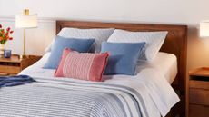 A modern bed with a mattress and pillows from Mattress Firm.