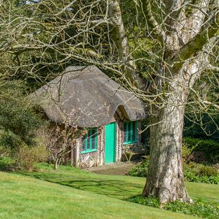 cottage with green door and window