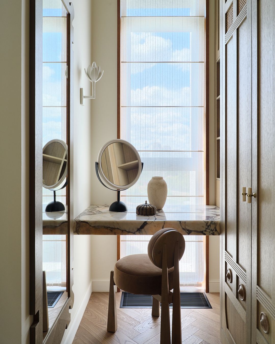 A vanity overlooking a window in a dressing room