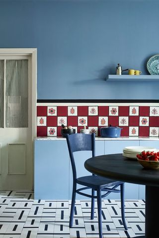 blue kitchen with red and white tile