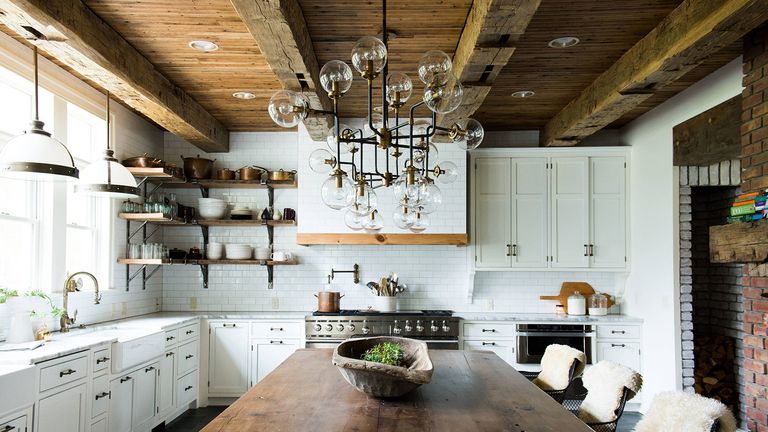 Modern Farmhouse Kitchen Ideas - a large kitchen with rustic shelving and globe glass chandelier