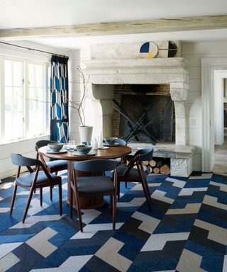 blue and white dining room with bold geometric pattern flooring