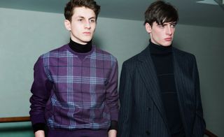 2 male models wearing black and purple clothes from Hermes AW15 collection
