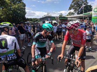 Jay McCarthy catches up with Adam Hansen at the start of the race