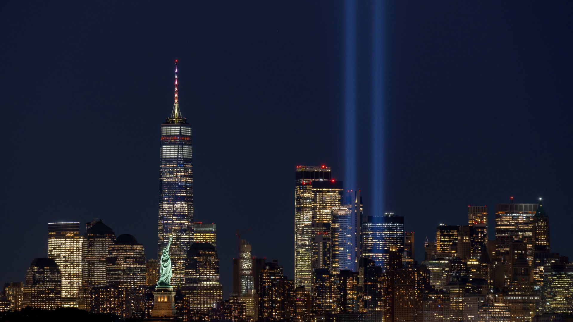 The New York City skyline with the 9/11 memorial lights