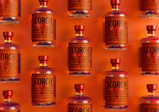 orange alcohol bottles with Scorch on the label