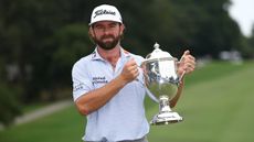 Cameron Young holds the Wyndham Championship trophy