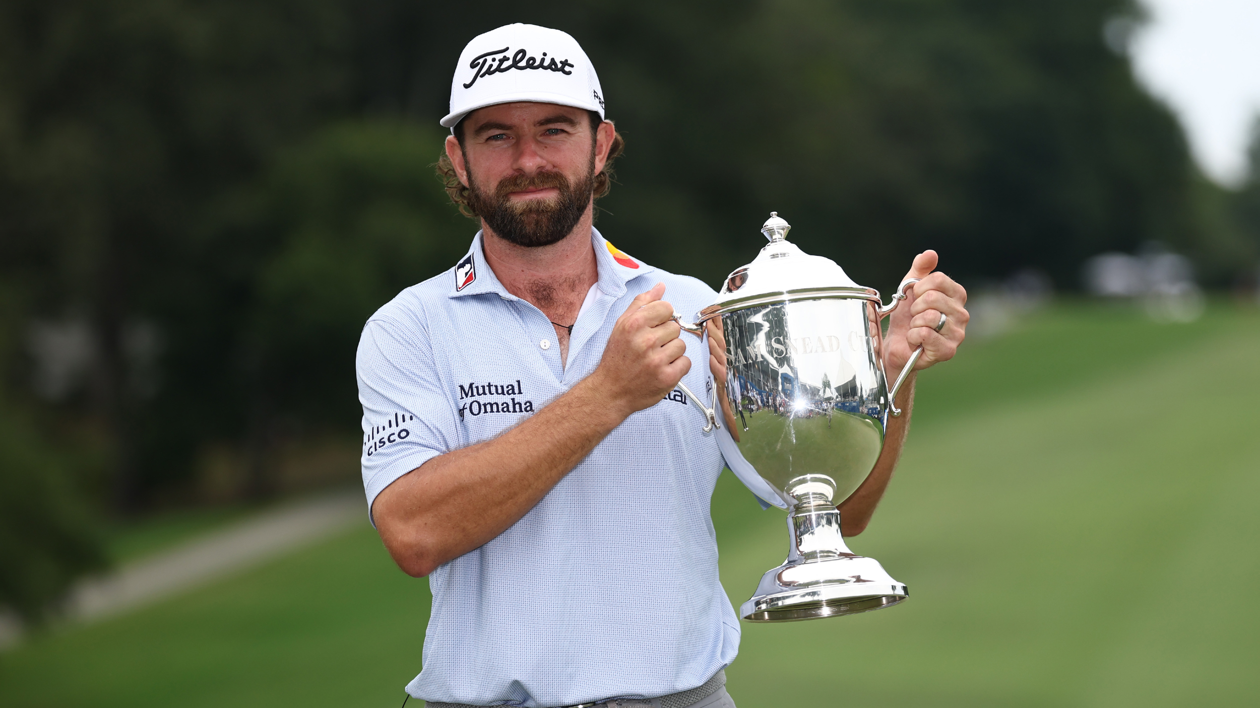 Cameron Young holds the Wyndham Championship trophy