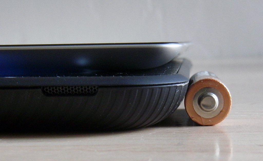 Thickness Compared to AA Battery and iPad 2 (top)