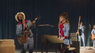 Bruno Mars (Left) on guitar and Lady Gaga (right) on keys 