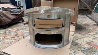 Breeo Live Fire pizza oven out of the delivery box