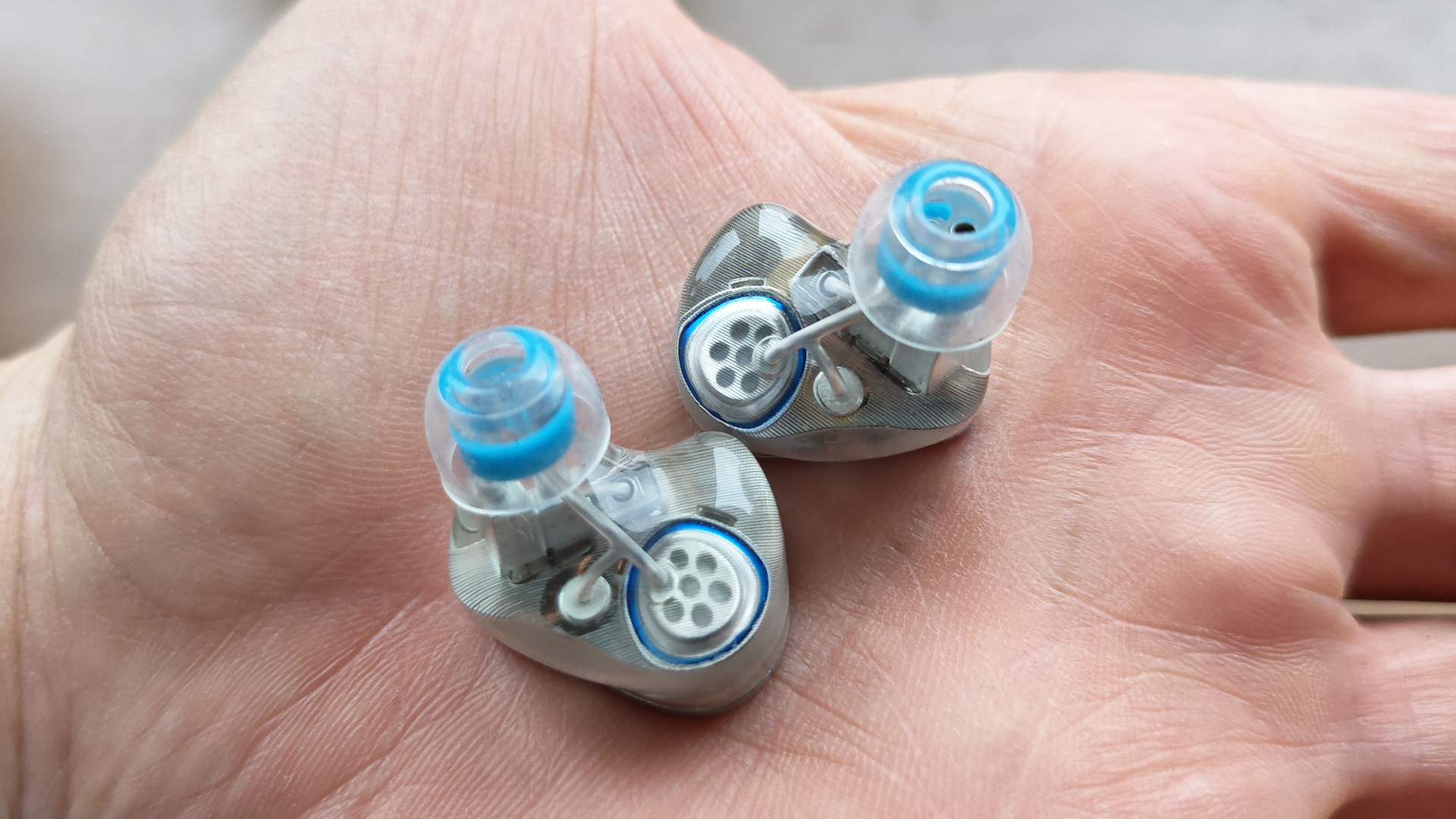 Different shots of the Binary EP321 MEMS IEMs on a home desk.