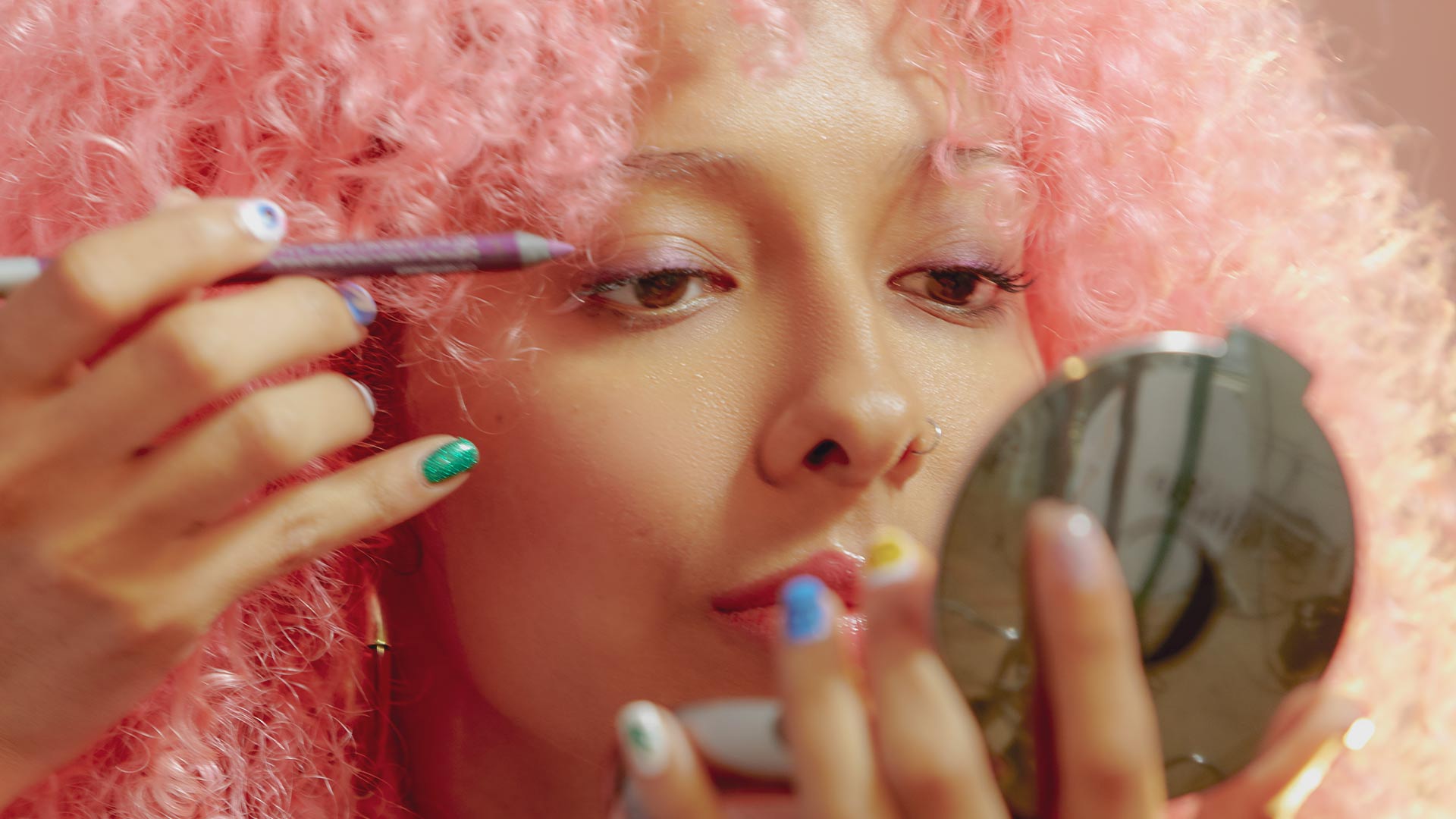 Woman applying eyeliner