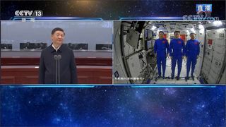 Chinese President Xi Jingping speaks with the three astronauts of China's Shenzhou 12 mission to the Tianhe space station module from the Beijing Aerospace Control Center on June 23, 2021.