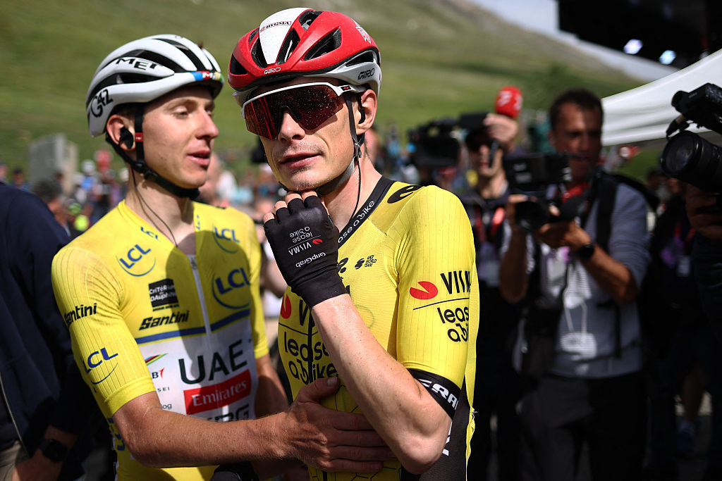 UAE Team Emirates XRG's Slovenian rider Tadej Pogaar (L) wearing the overall leader's yellow jersey and Team Visma - Lease a Bike's Danish rider Jonas Vingegaard react at the end of the 77th edition of the Criterium du Dauphine cycling race, 133,3 km between Val-d'Arc and Val-Cenis - Plateau du Mont Cenis, on June 15, 2025. (Photo by Anne-Christine POUJOULAT / AFP) (Photo by ANNE-CHRISTINE POUJOULAT/AFP via Getty Images)