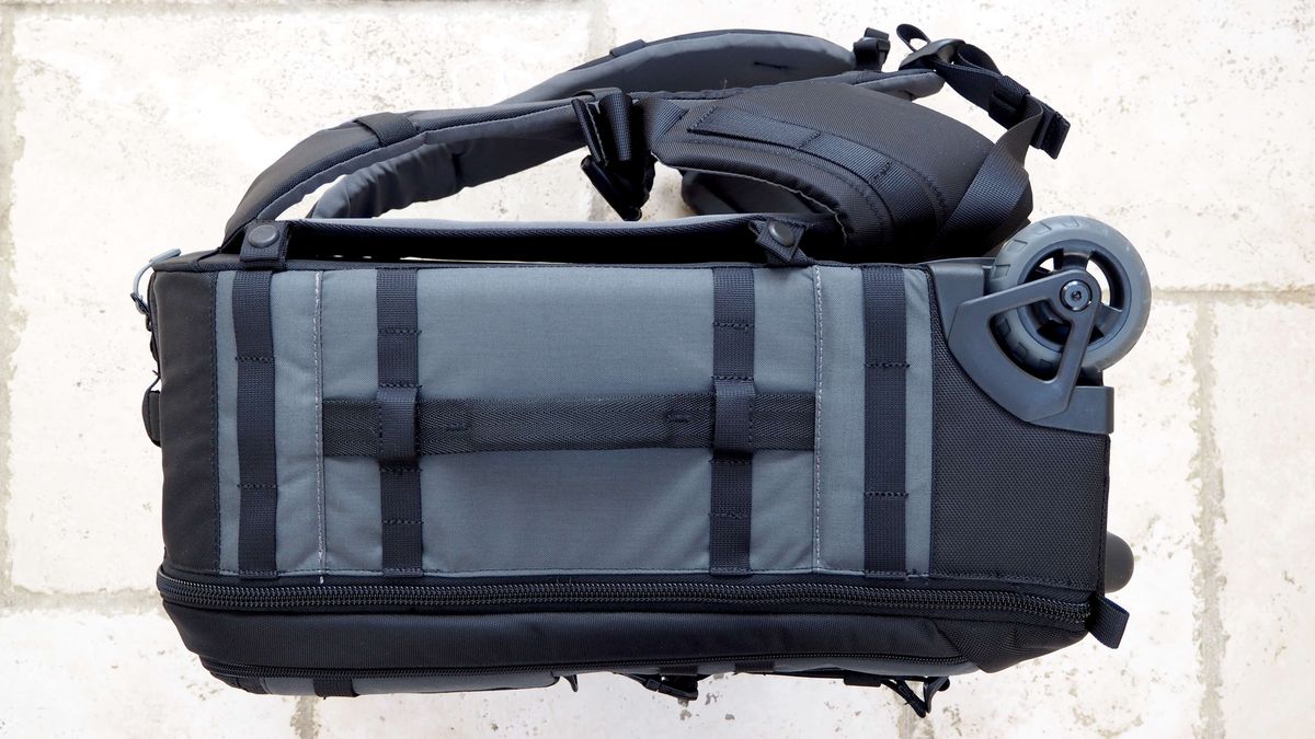 Lowepro Pro Trekker RLX 450 AW II roller backback on a light stone floor