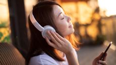 Woman listening to music on headphones