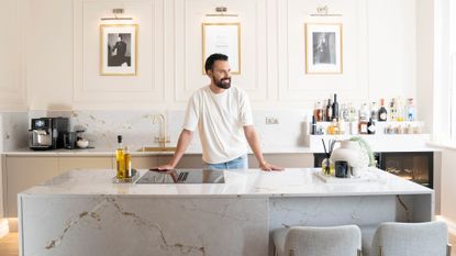 Rylan Clarke standing in his sophisticated neutral kitchen
