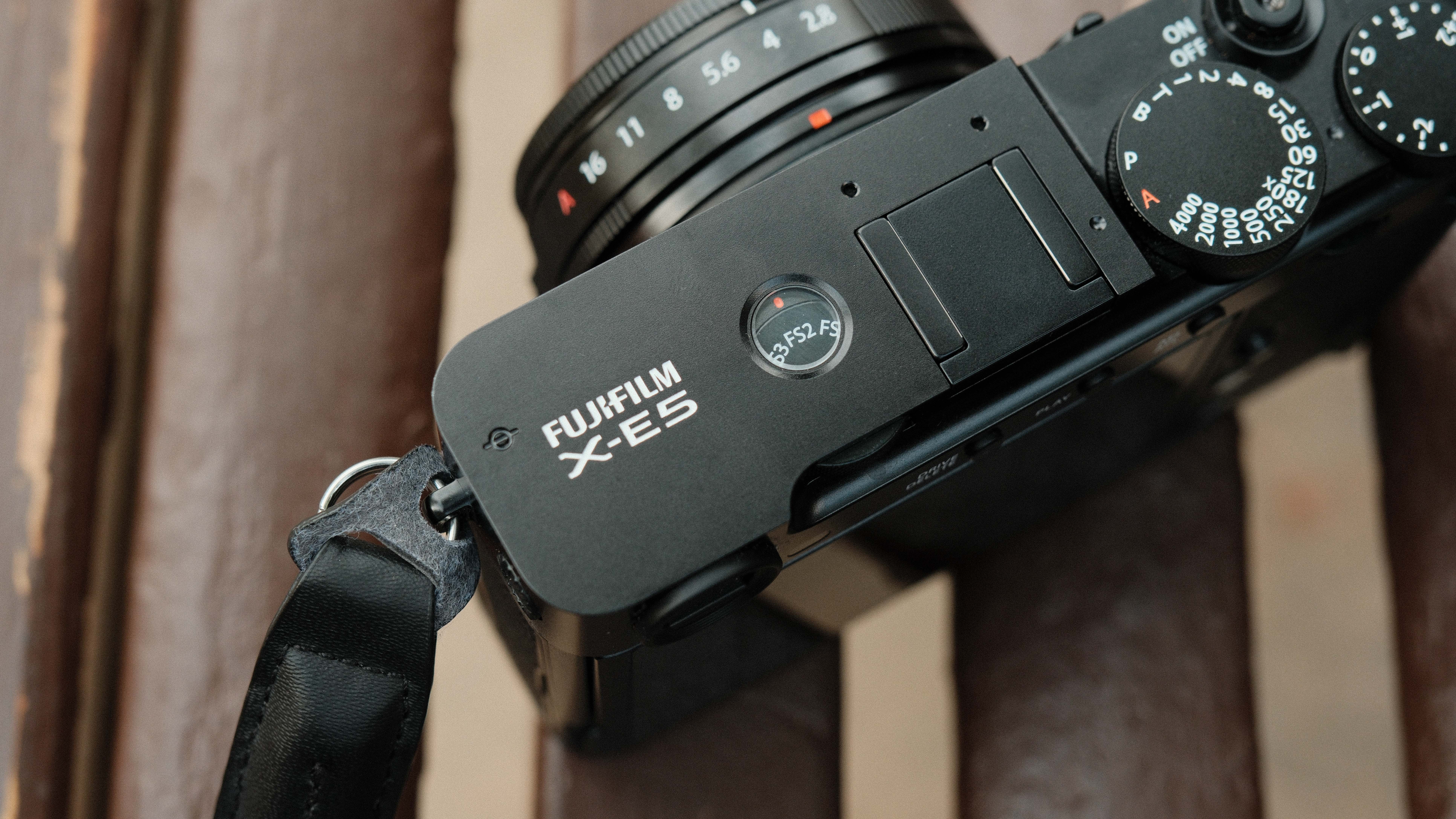 Fujifilm X-E5 camera on a wooden bench