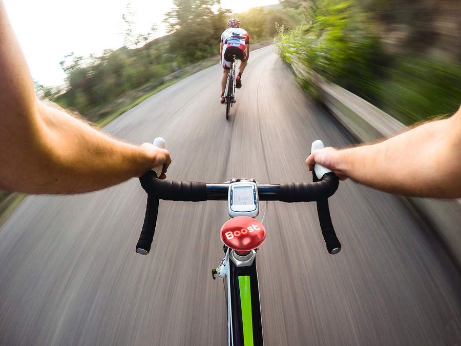 Image of a bike rider with a red button