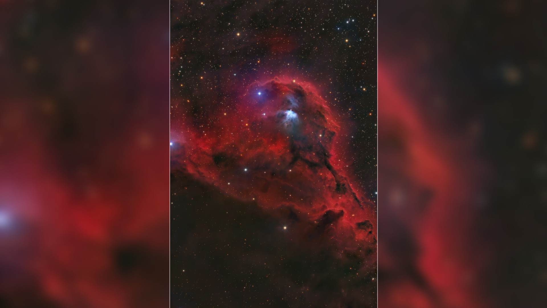 a bright red cloud of dust on a starry background