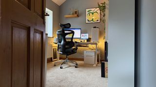 The Sihoo C300 Pro office chair, facing a desk, in a home office. 