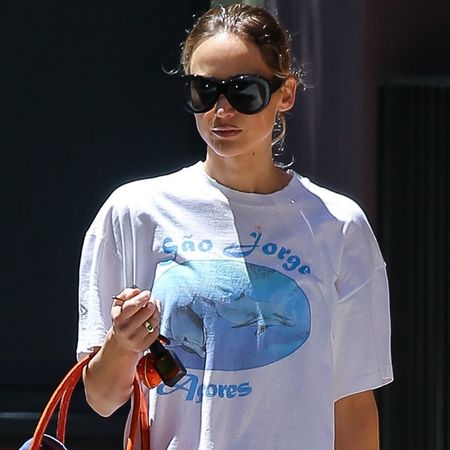 Jennifer Lawrence Proves the Bermuda Shorts Trend Works With Anything&mdash;Even a Bright Orange Croc Bag