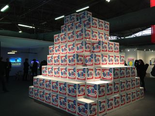 A pyramid of boxes with each box designed with BRILLO logo with a red, white and blue design colour.