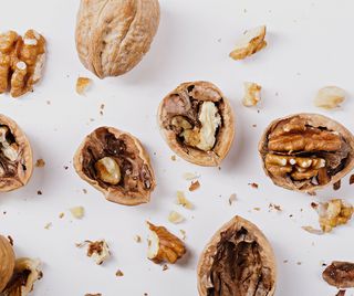 Walnuts, with their shells cracked open