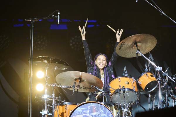 Nandi Bushell, arms aloft in triumph