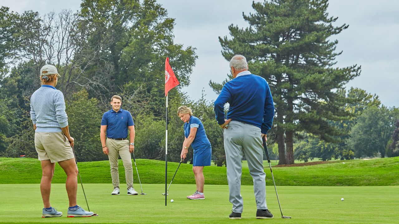 A generic image of golfers on a green