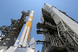 A Delta 4 rocket stands poised on the launch pad to loft the WGS-5 military satellite in May 2013.