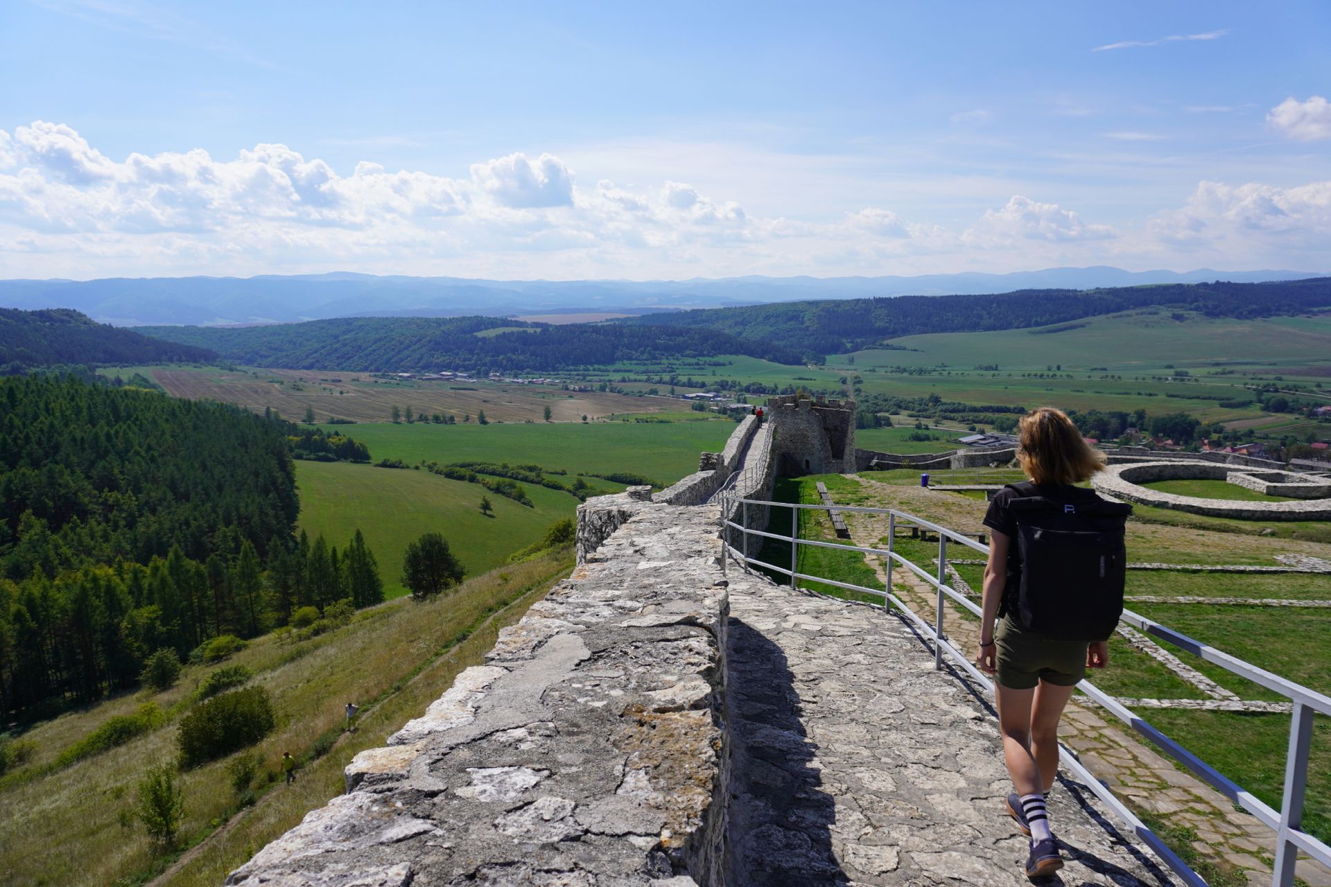 Image shows Anna walking in the Crankbrothers Stamp Lace flat shoes while on a gravel bikepacking trip.