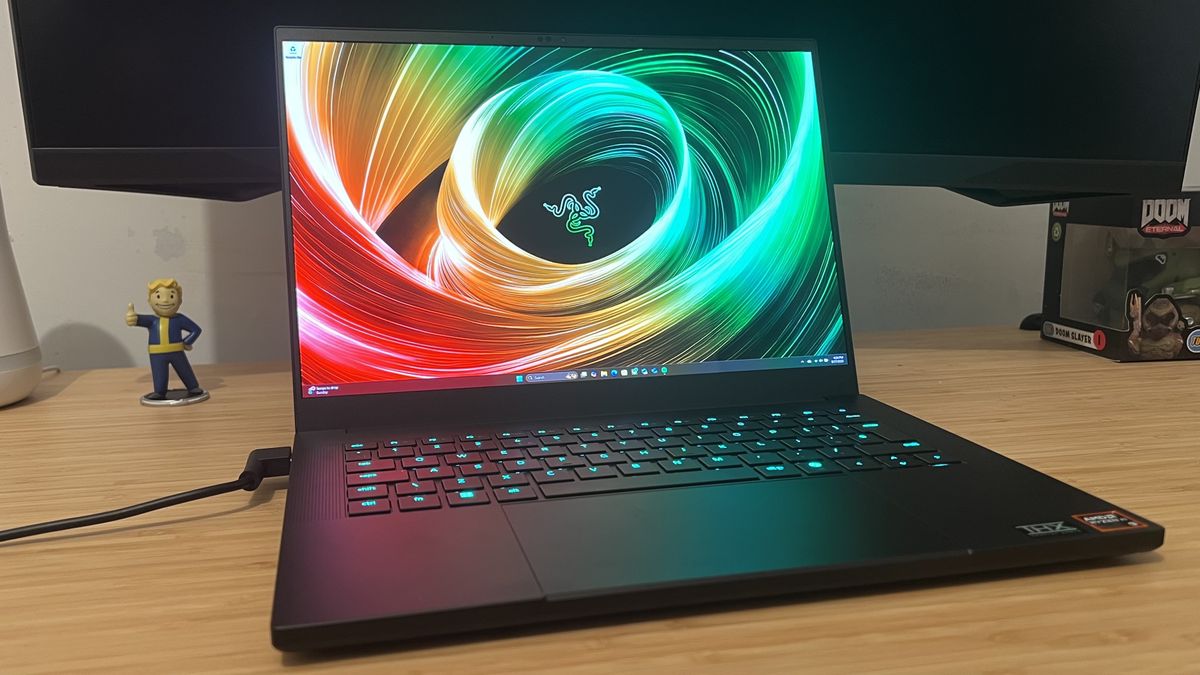 Razer Blade 14 gaming laptop on a wooden desk