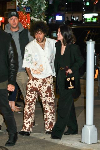 Selena Gomez and Benny Blanco walk hand in hand while arriving for dinner with friends at 4 Charles Prime Rib in the West Village, New York.