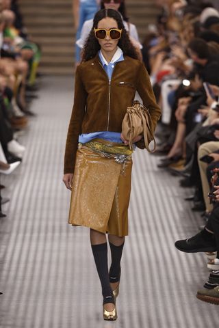 A model walks the runway during the Miu Miu Paris Womenswear Spring-Summer 2025 show as part of Paris Fashion Week