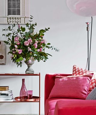 living room with pink soft furnishings